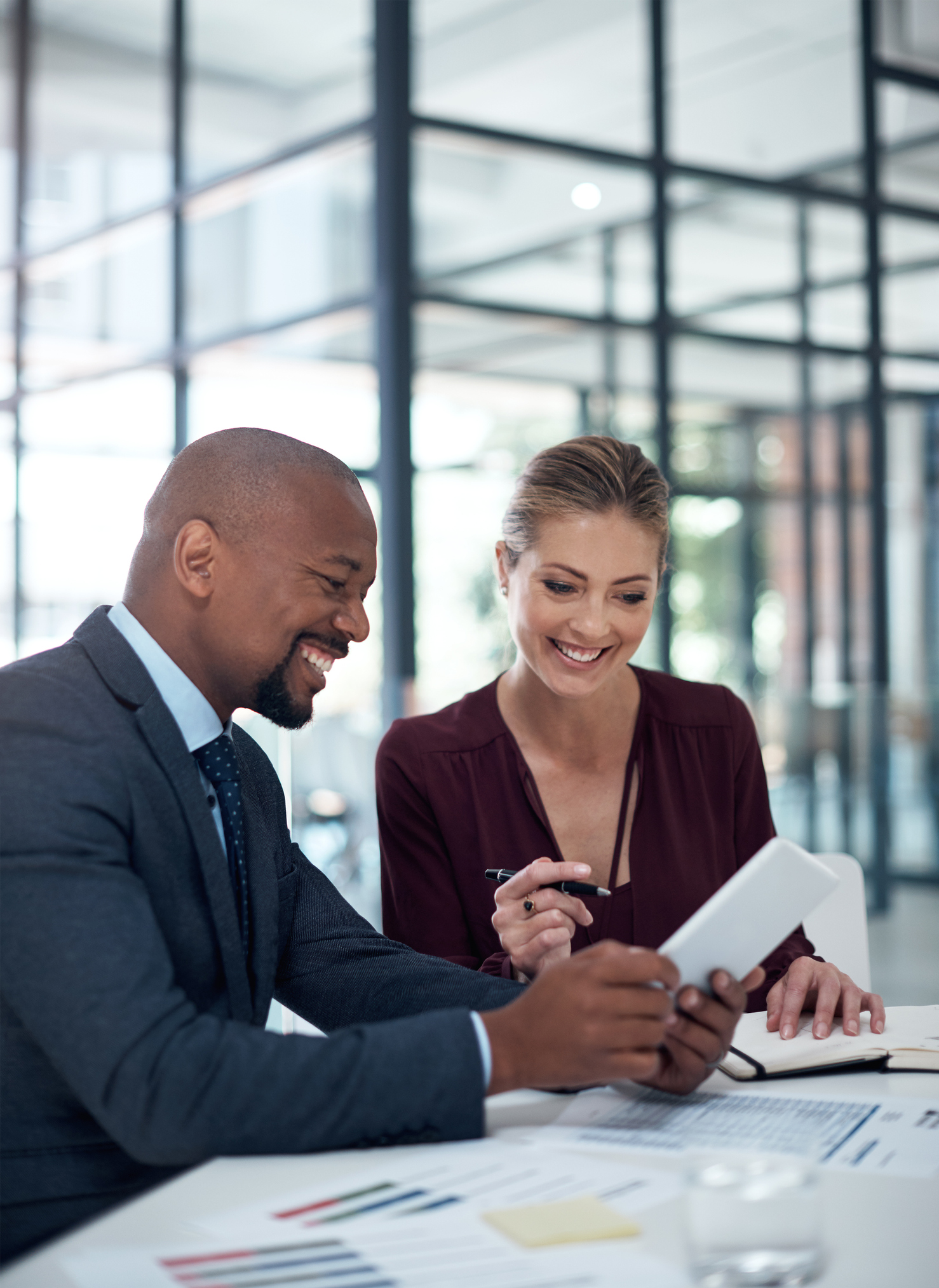 Business partners looking at a phone